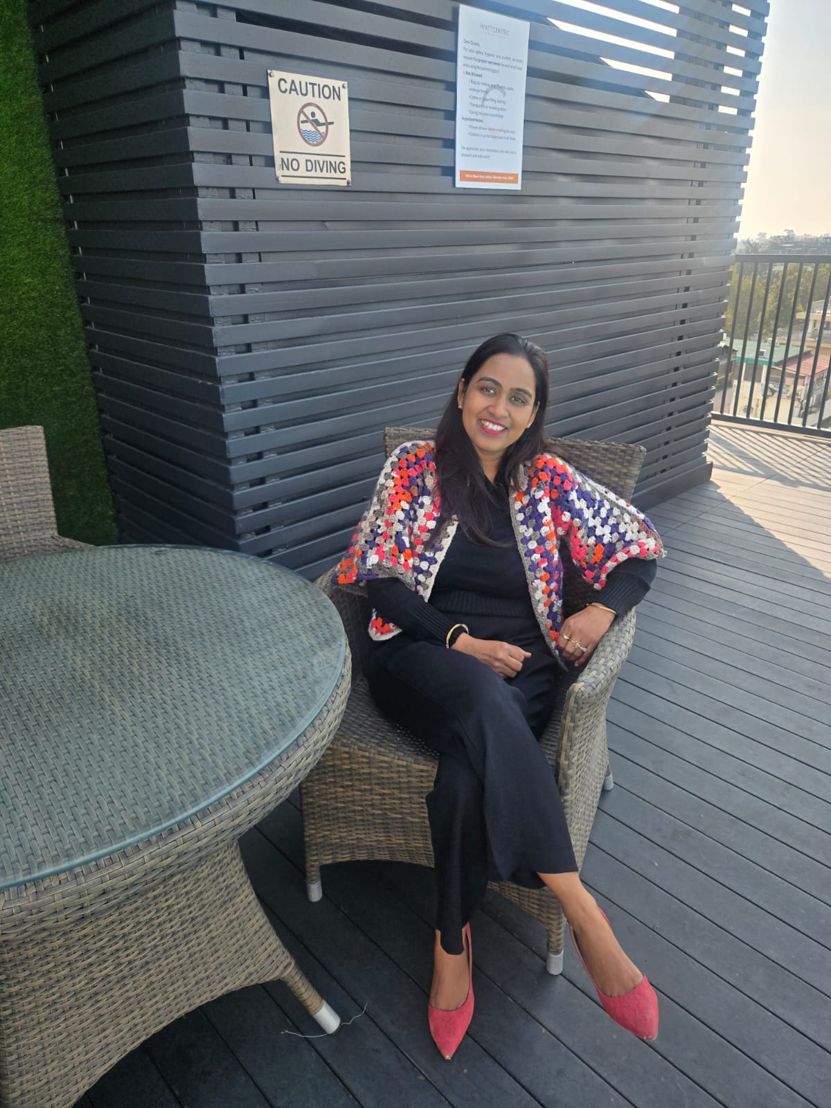 Dr. Nisha Singla seated at a conference venue in Dehradun